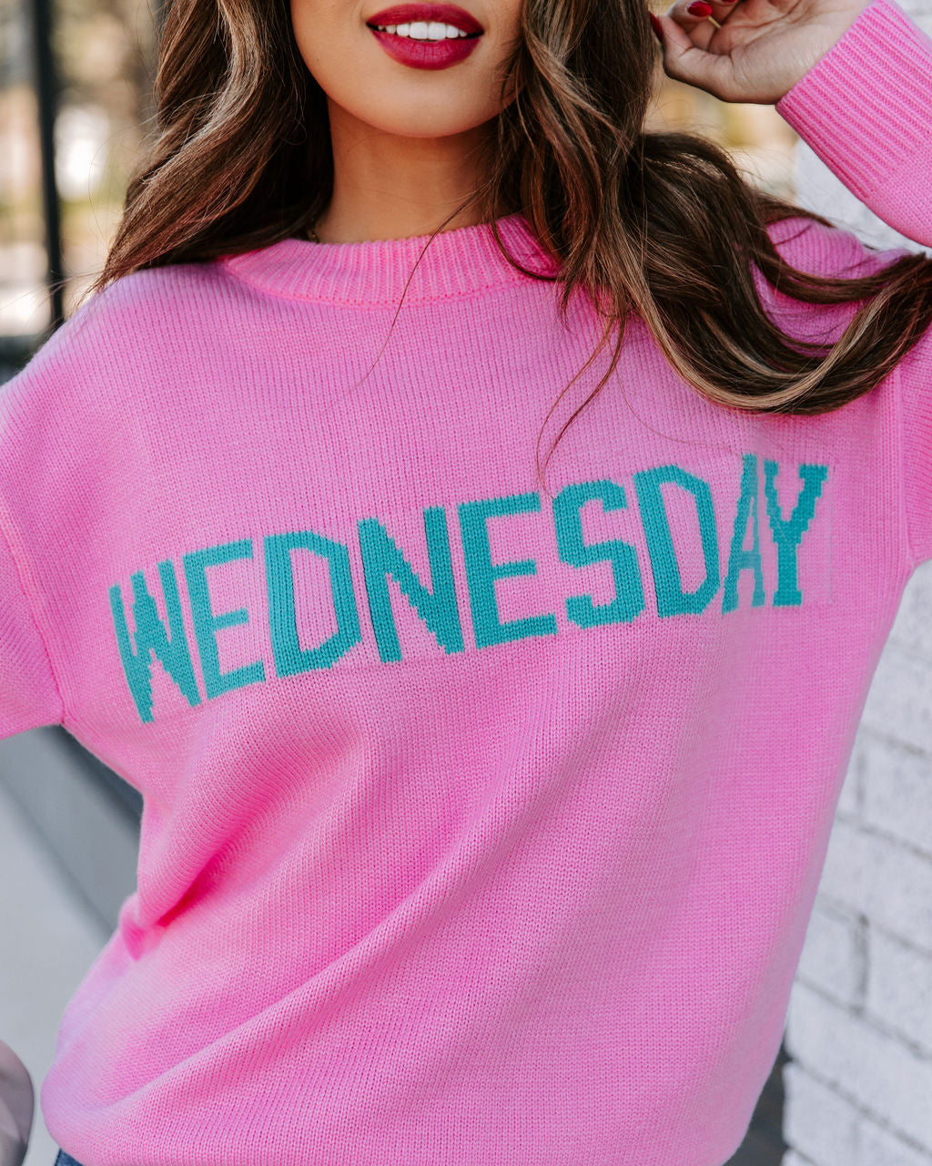 Wednesday Wearing Pink Knit Sweater
