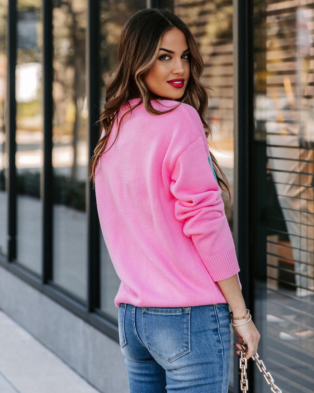 Wednesday Wearing Pink Knit Sweater