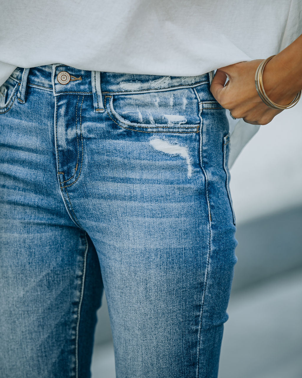 Offset High Rise Distressed Flare Denim
